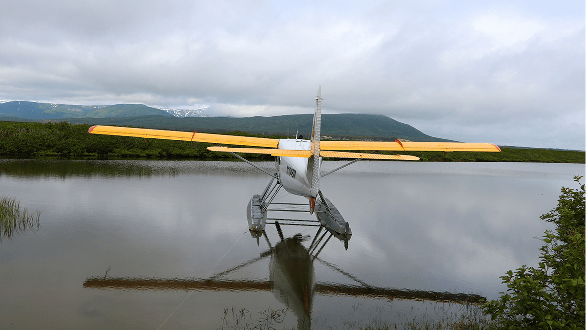 Yellow sea plane over the Kachemak Bay in Alaska.