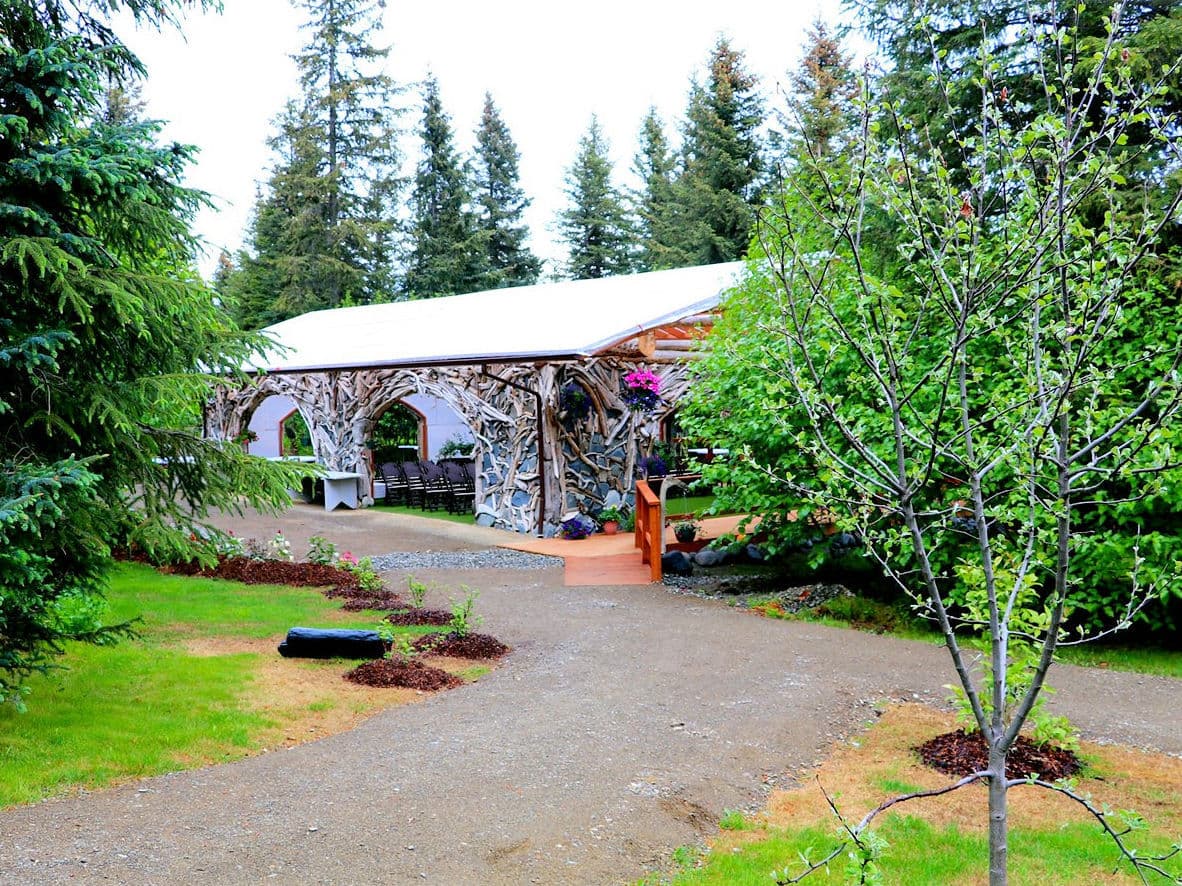 Beautiful outdoor rustic wood clad open building set up for a wedding Beautiful outdoor rustic wood clad open building set up for a wedding
